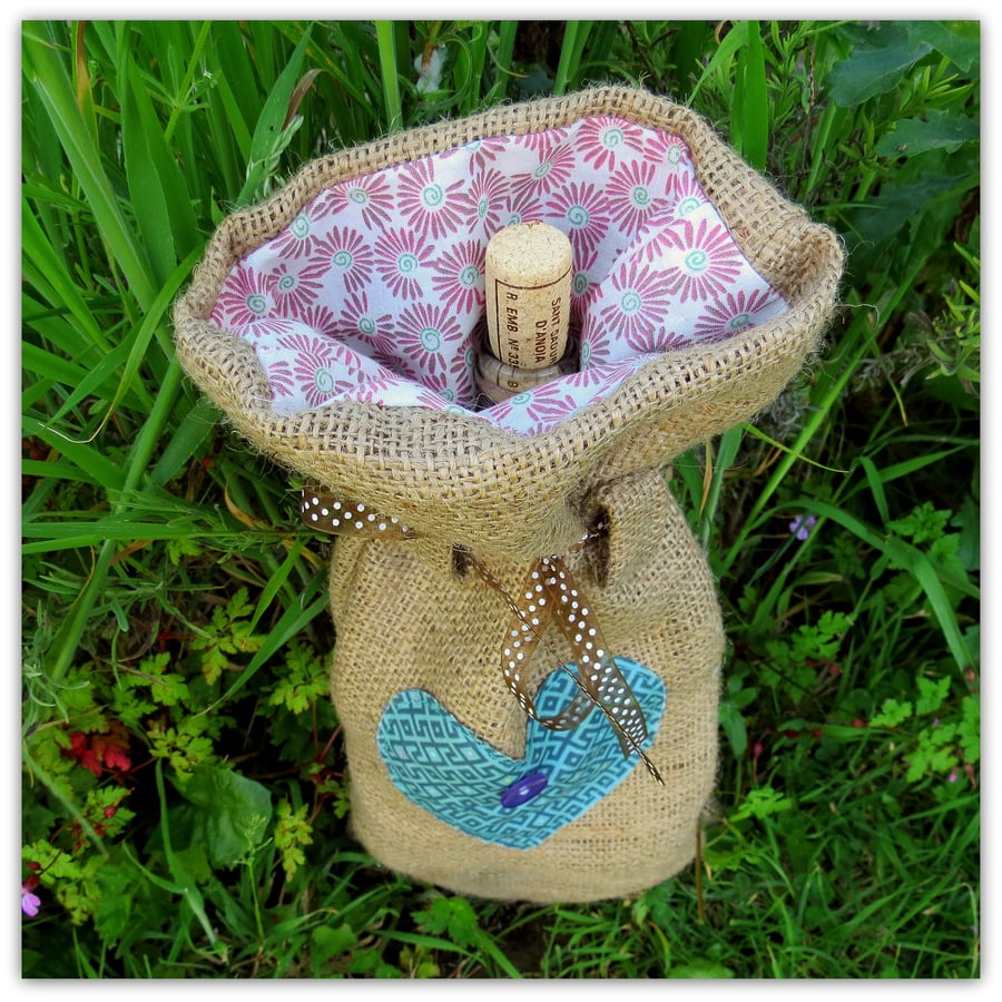 A rustic hessian bottle bag.  Gift bag.  Reusable.  