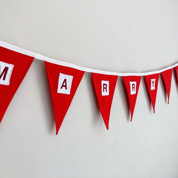 Marry me? Red cotton fabric bunting. Proposal, engagement decor