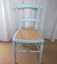 Upcycled antique chair in pale blue chalk paint, re-caned seat.