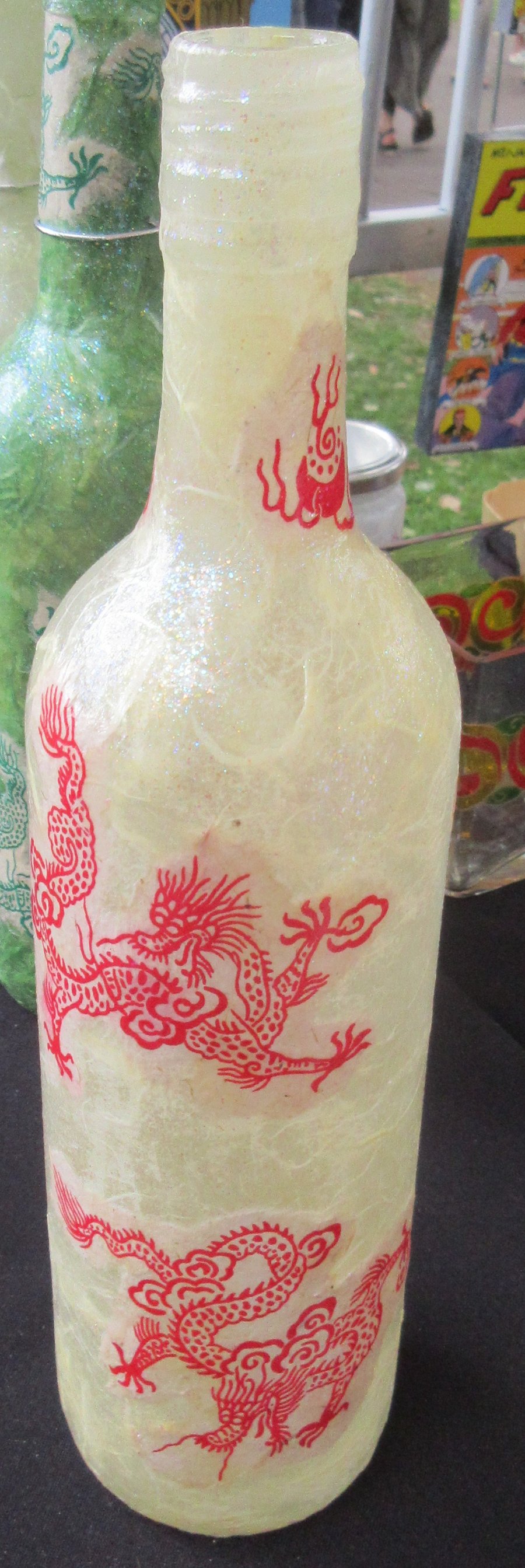 Bottle decoupaged in handprinted red Chinese dragons - available with lights
