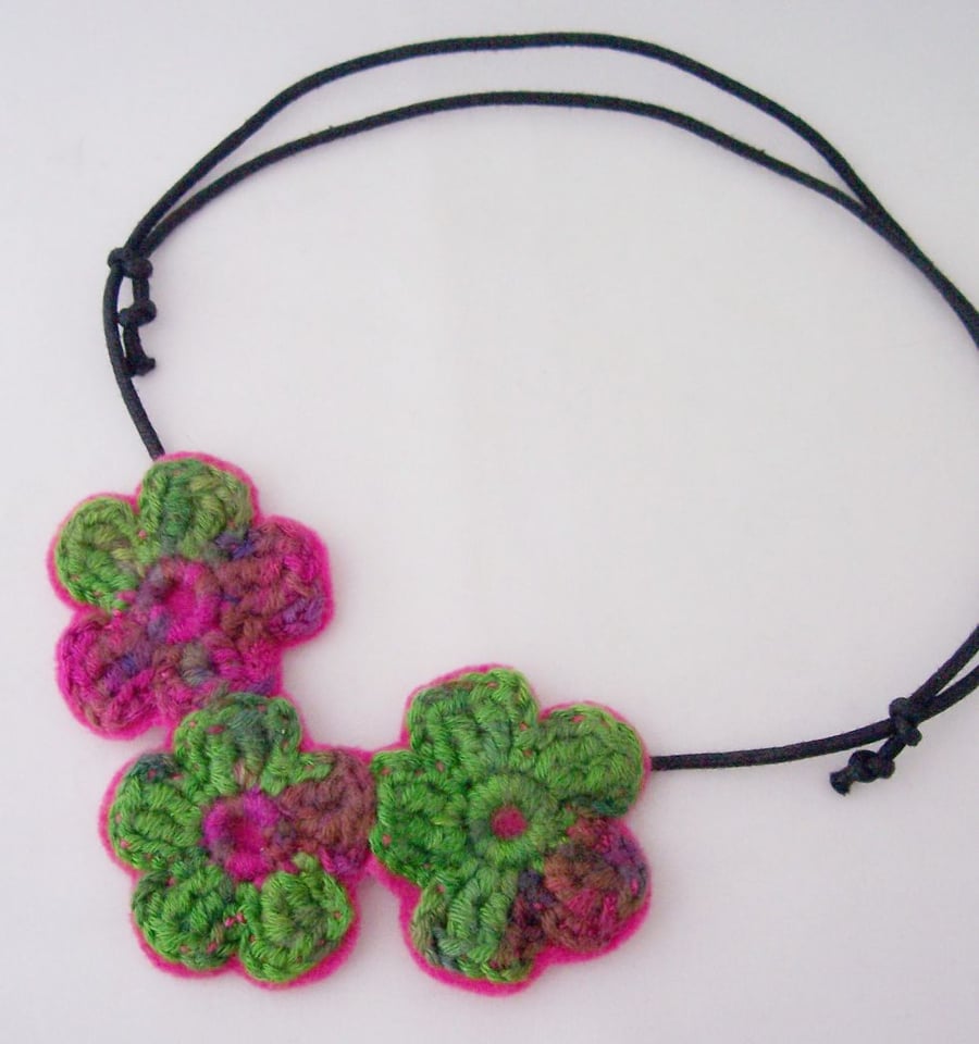 Crochet flower necklace in hot pink and emerald green