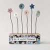 Button and Clay Flower Garden in a Floral Block 'Be a wild flower'