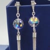 Sparkling Chrystal globe earrings with silver tassels