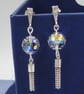 Sparkling Chrystal globe earrings with silver tassels