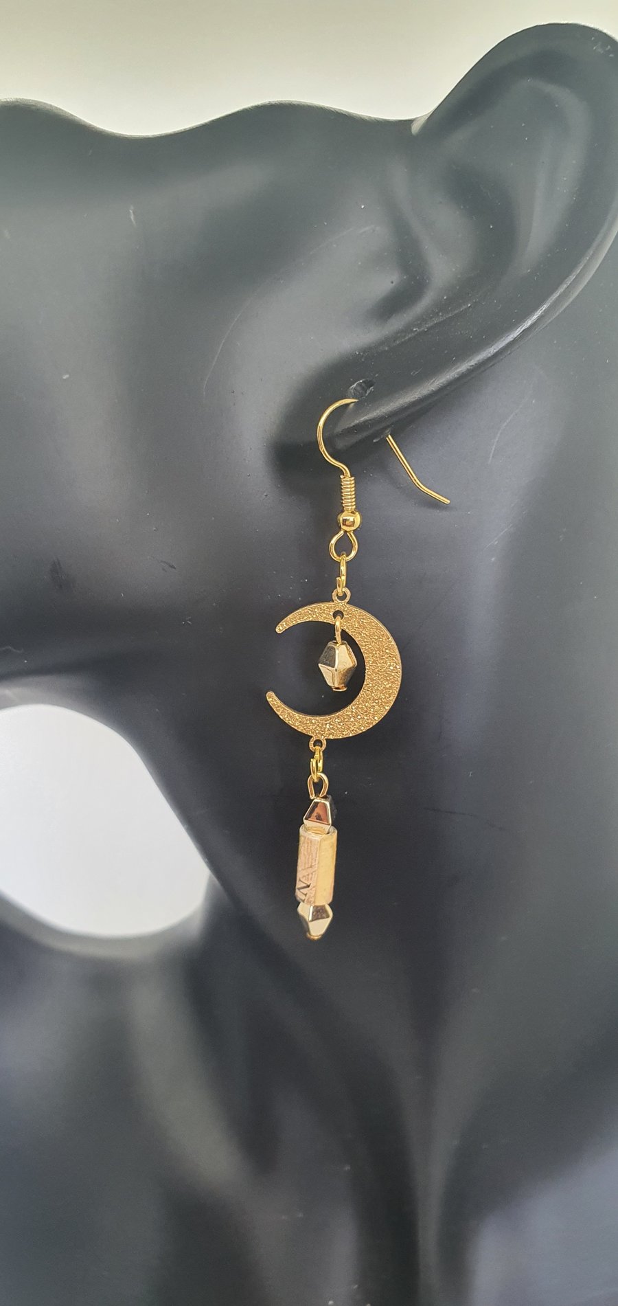 Golden crescent moon earrings with hand rolled paper beads