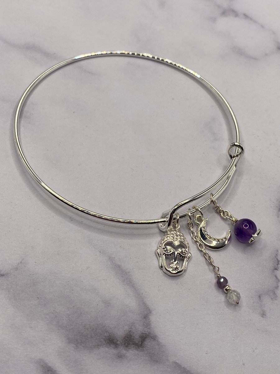 Silver plated charm bangle with clear topaz and amethyst stones 