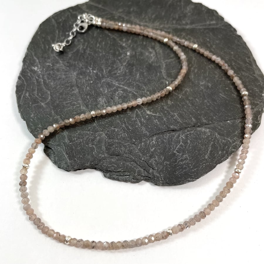 Faceted chocolate moonstone and silver bead necklace.