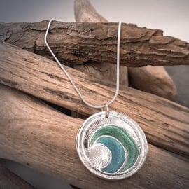 Silver pendant necklace with wave design