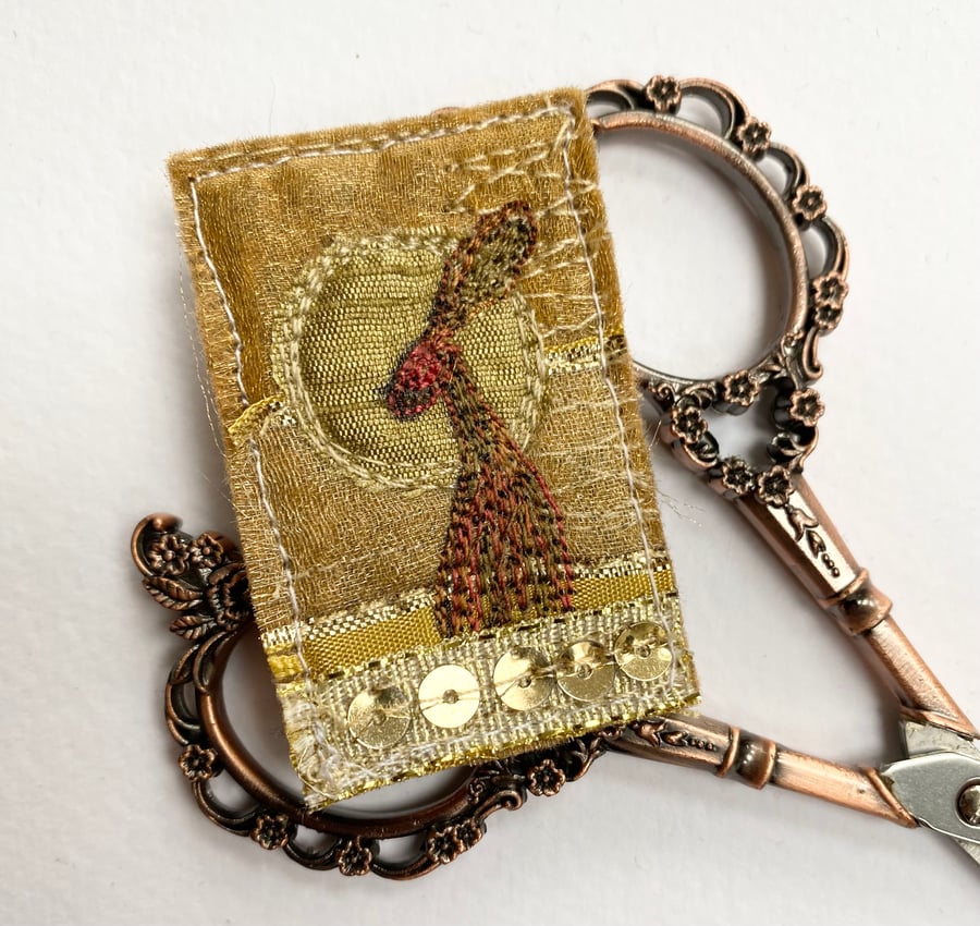 Upcycled harvest hare sunset brooch pin or badge. 