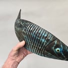 Articulating fish in pine