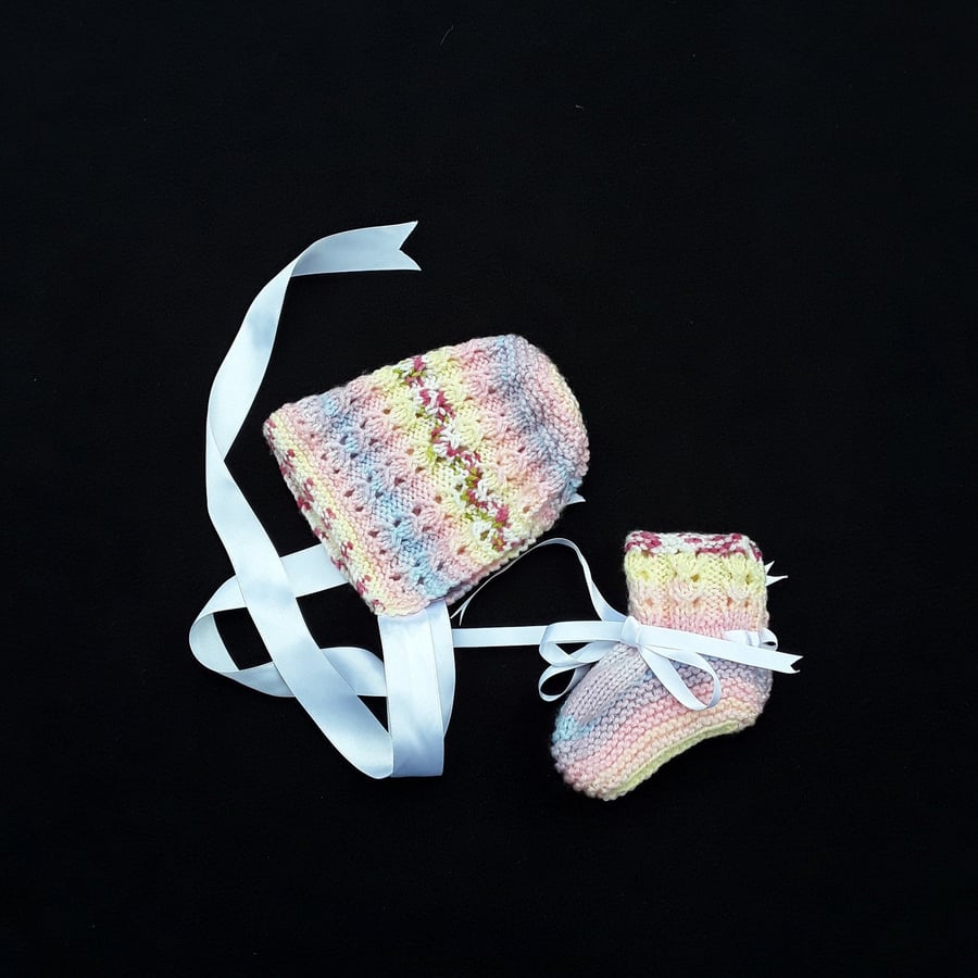 Hand knitted pink multicoloured baby bonnet and booties set 0 - 3 months 