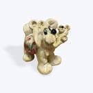 Handcrafted Ceramic Dog carrying his Teddy Bear - just the cutest