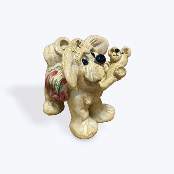 Handcrafted Ceramic Dog carrying his Teddy Bear - just the cutest