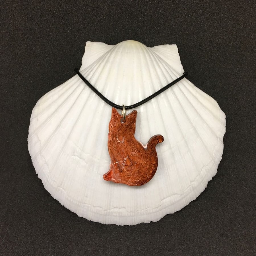 Ginger and white cat pendant, resin and ink on black cord necklace.