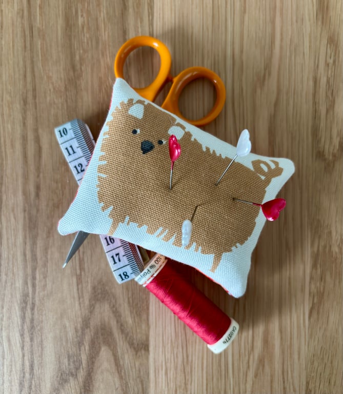 Cute “fluffy dog” pincushion with orange and red print back