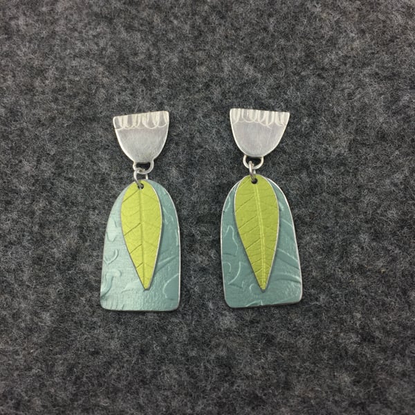 Handmade silver and aluminium textured earrings in pale teal and green 