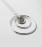 Circles Necklace. Recycled Sterling Silver Pebble with Daffodil & Rings - Image 5