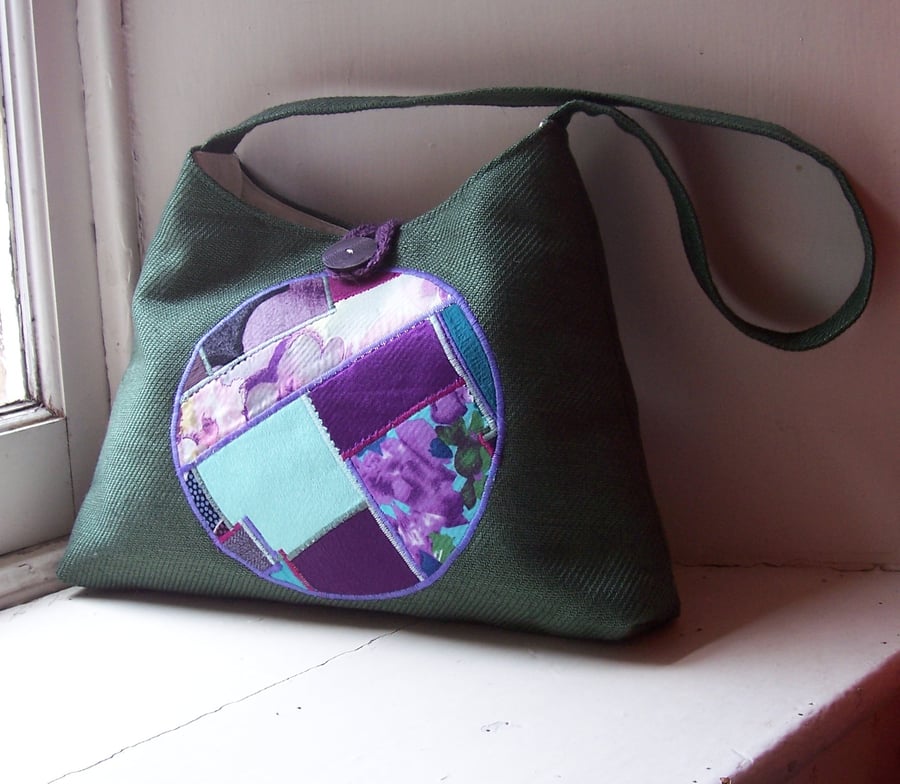 Textile shoulder bag in forest green with art panel