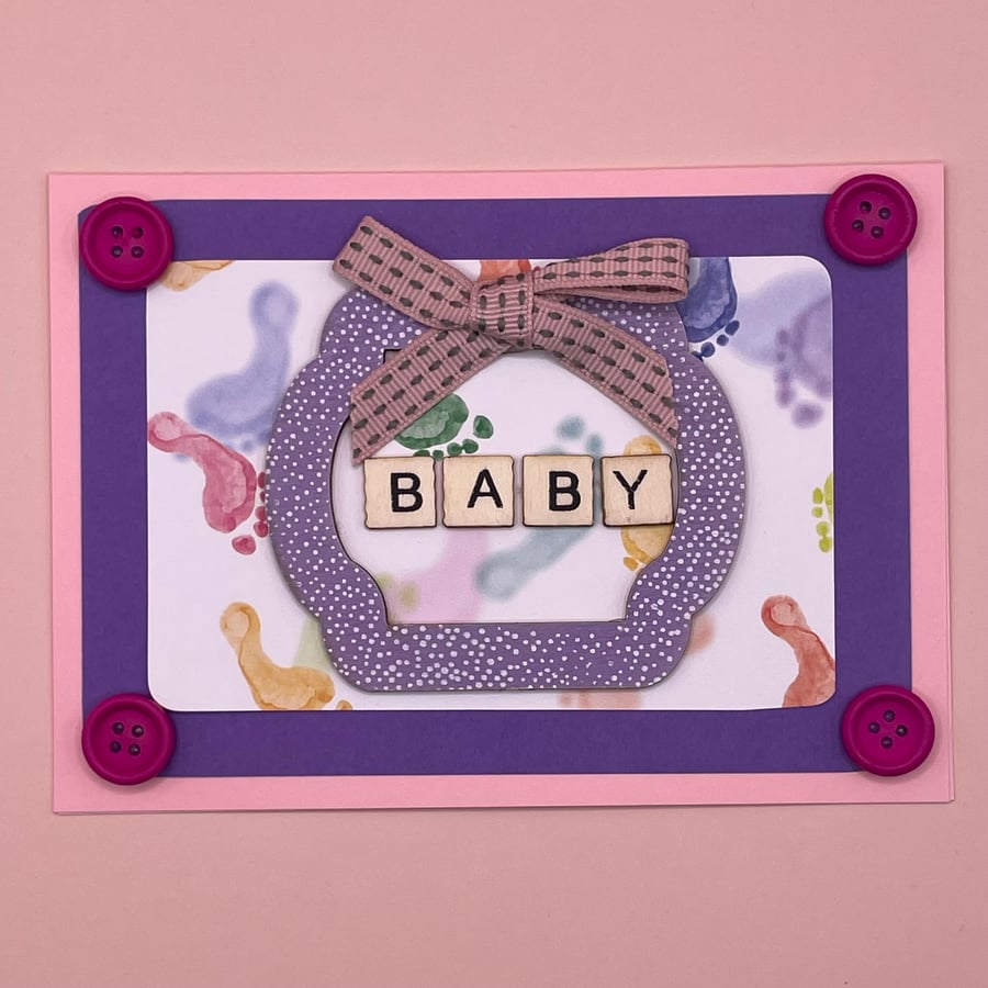 baby girl card with cute footprints