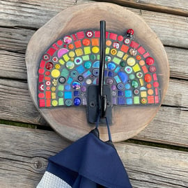 Wooden coat or bag hook decorated with a mosaic rainbow