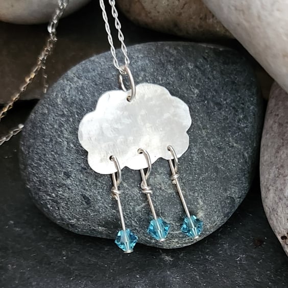 Cloud pendant in sterling silver with blue crystal raindrops