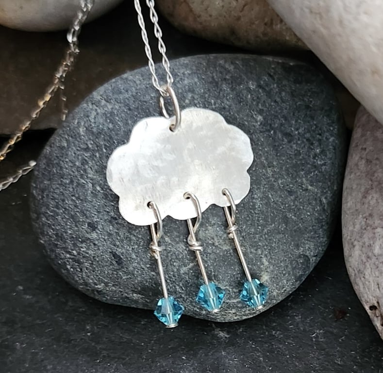 Cloud pendant in sterling silver with blue crystal raindrops