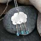 Cloud pendant in sterling silver with blue crystal raindrops
