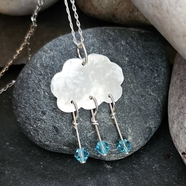 Cloud pendant in sterling silver with blue crystal raindrops