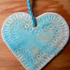 Heart in Ceramic with a Turquoise Glaze.