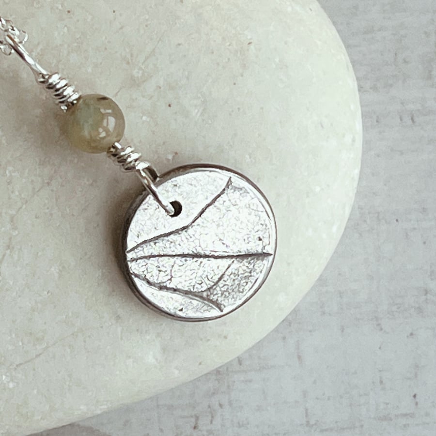 Botanical silver pendant with ivy design and tourmaline bead.