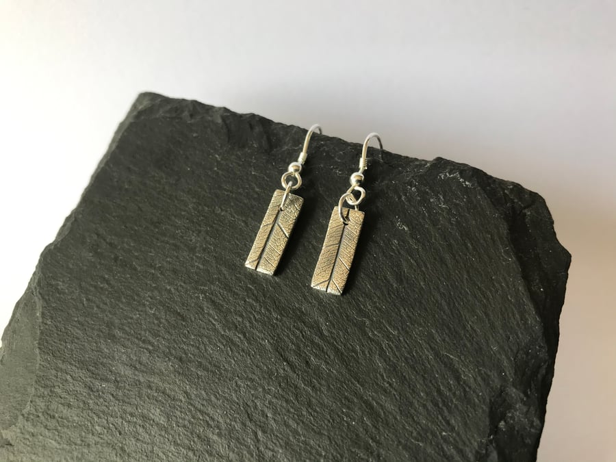 Fine silver rectangle dangly earrings with leaf imprint