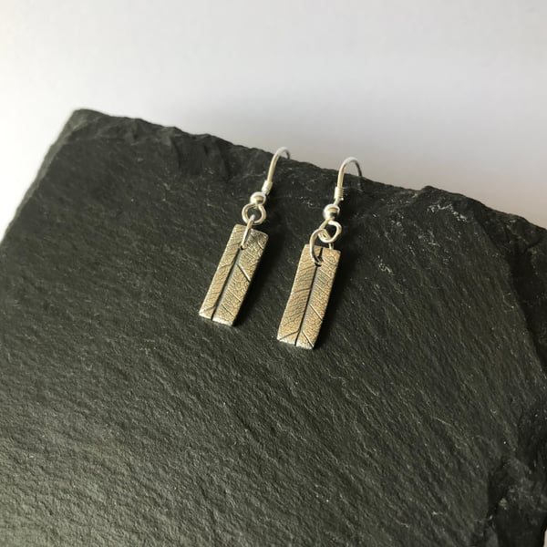 Fine silver rectangle dangly earrings with leaf imprint