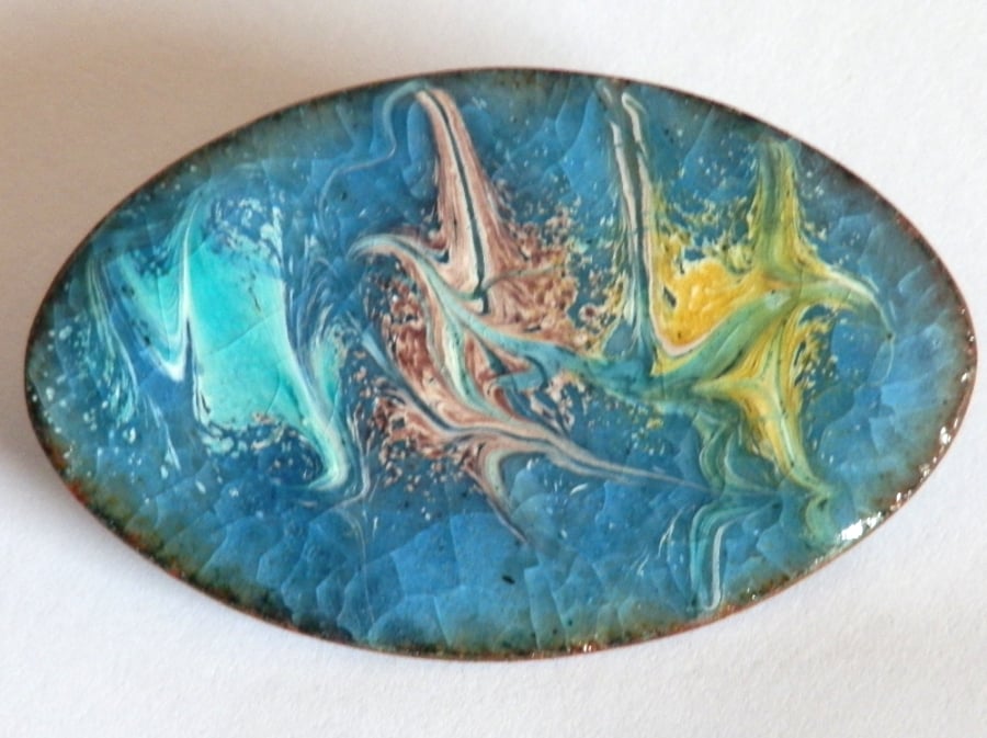 Narrow oval brooch - sky blue with turquoise, pink, and yellow scrollwork