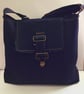 Denim satchel style crossbody bag.