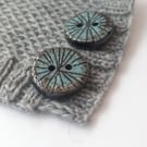 A set of 3 25mm buttons, Black and blue buttons. Inspired by mill stones. 