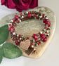 Deep red handmade Czech glass memory wire wrap bracelet with leaf charms - Image 2