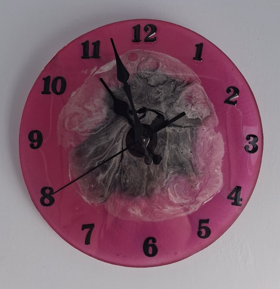 Handmade epoxy resin clock with hanger. Battery operated.