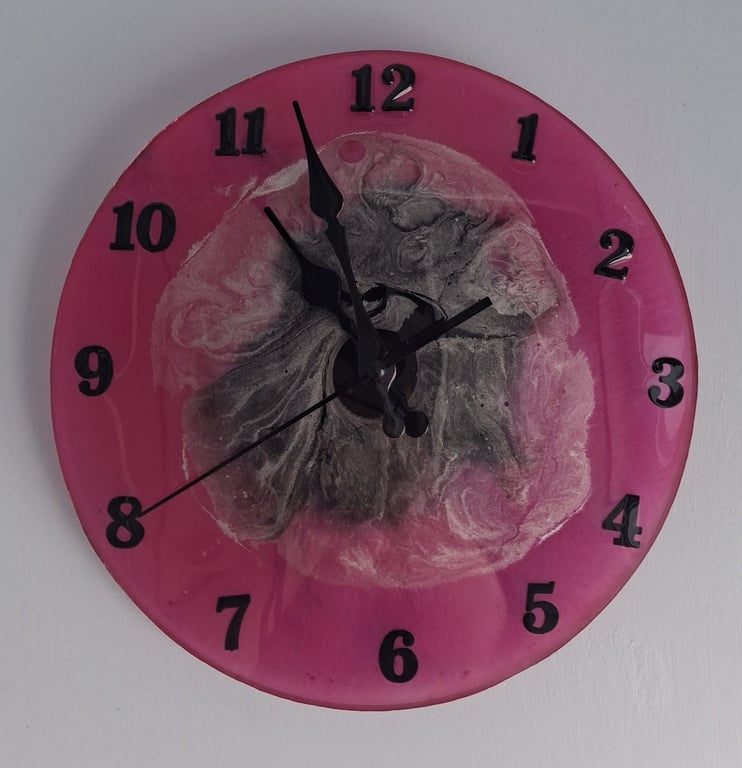 Handmade epoxy resin clock with hanger. Battery operated.