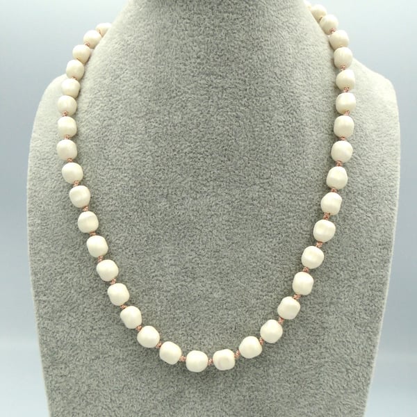 Cream pearl necklace  Traditionally knotted with pink silk thread 