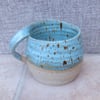 Handthrown coffee mug in stoneware.