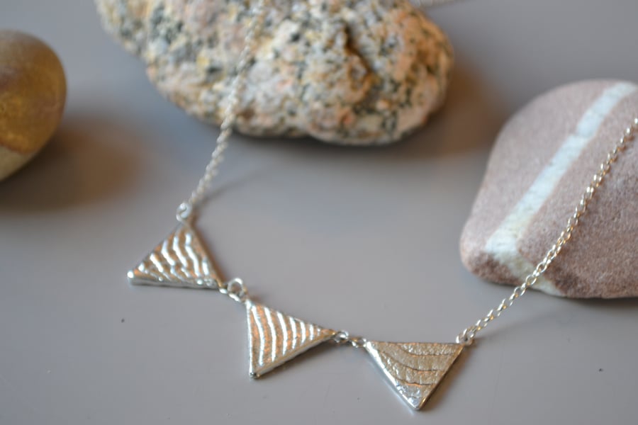 Triangle silver necklace, cuttlefish cast 3 triangle necklace, texture, tactile,