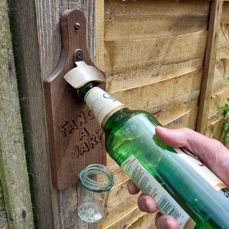 Wall mounted bottle opener with glass jar cap catcher