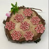 Set of eight little handmade ceramic flower buttons red