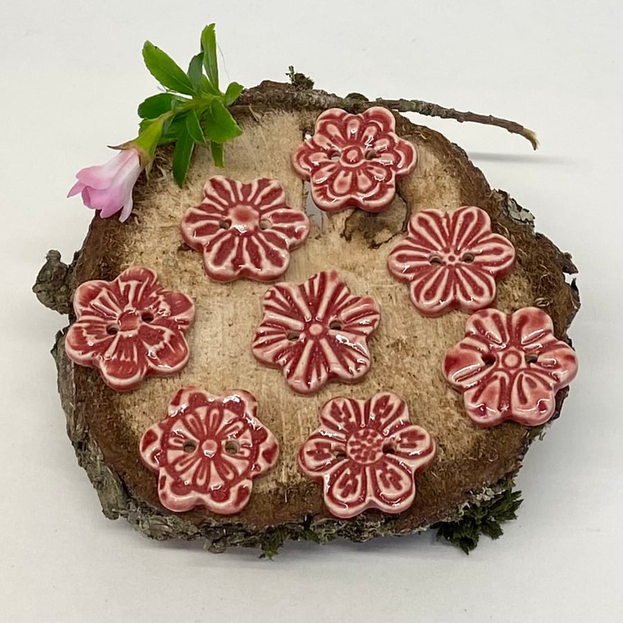 Set of eight little handmade ceramic flower buttons red