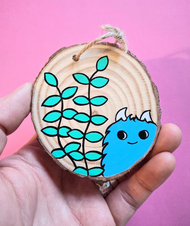 Chep monster enjoying his tiny garden - Acrylic painting on a wood-slice