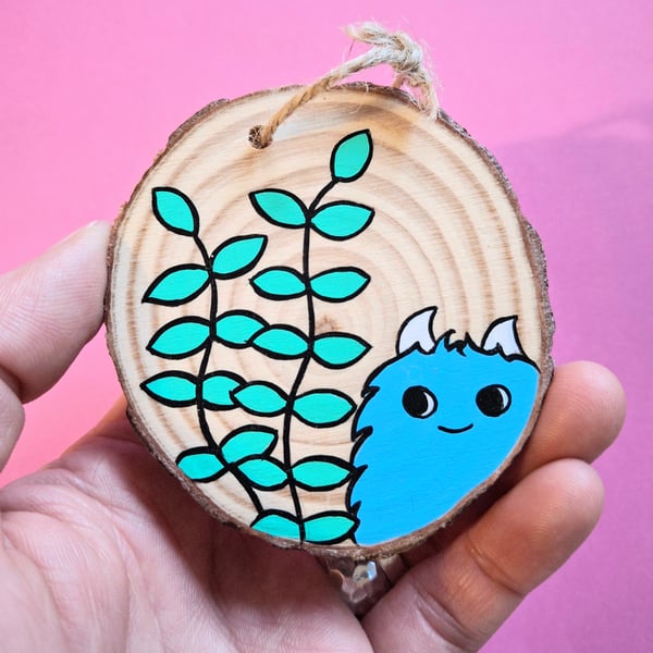 Chep monster enjoying his tiny garden - Acrylic painting on a wood-slice