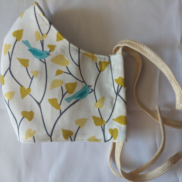 Cotton face mask with bird and leaf pattern