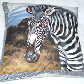 On Safari cushion with a Zebra on a grass plain