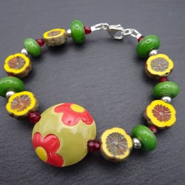 lampwork glass bracelet, green and yellow ceramic focal