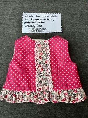 Frills and lace make this a beautiful little top for your doll